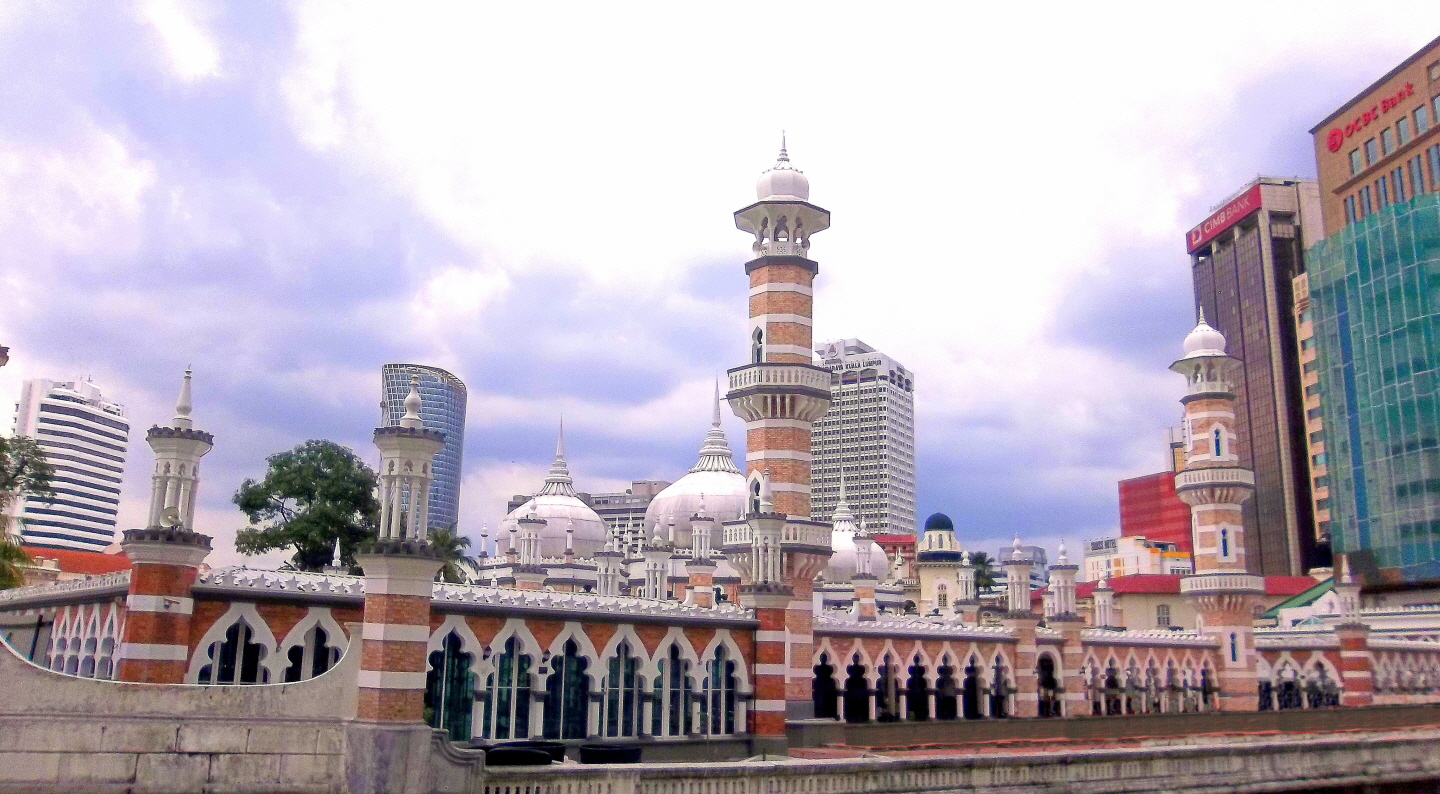Masjid Jamek Kuala Lumpur (1907) - (includes Arabic, Moorish & Mogul architectural  styles) amidst Kuala Lumpur Skyscrapers